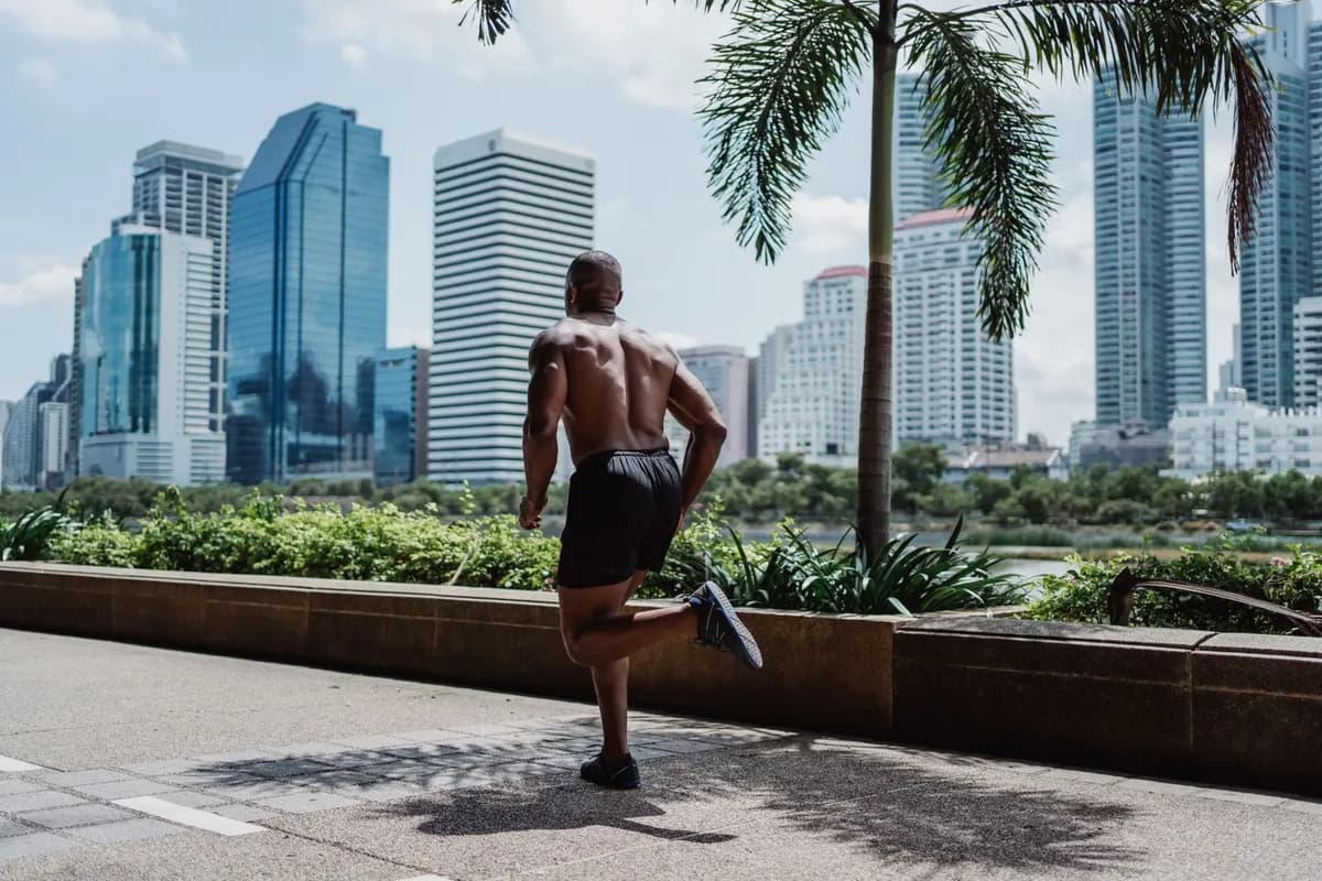 Man looking tired after intense overtraining session — overtraining hair loss telogen effluvium