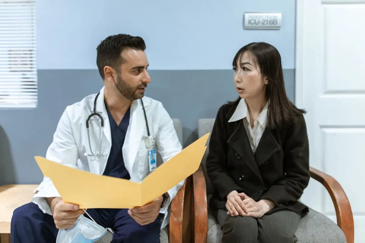Doctor consulting a patient about hair-loss medication side effects in a clinical setting in Malta
