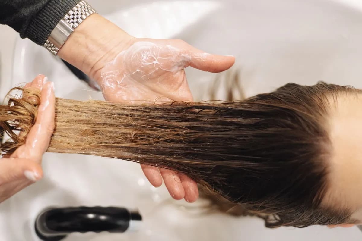 Professional scalp assessment during a clinical hair care consultation in Malta
