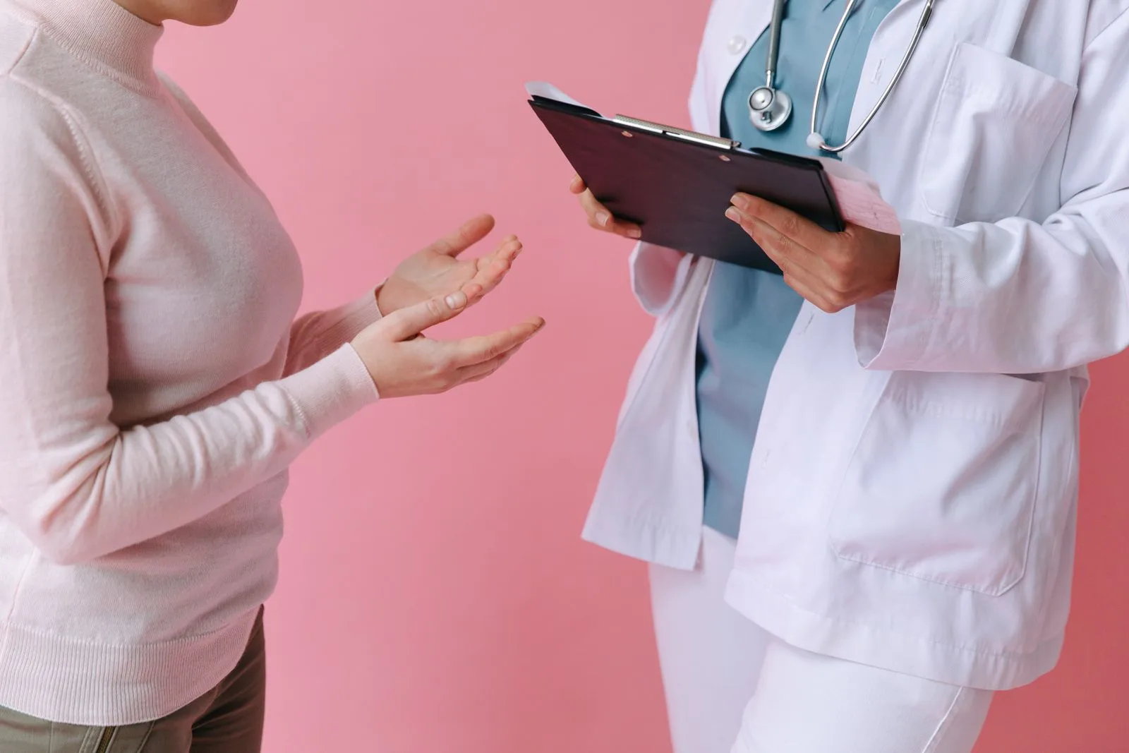 Doctor and patient in a calm consultation reviewing hair loss treatment options
